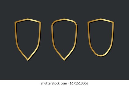 Escudos con marcos dorados y dorados aislados en fondo negro. Elementos de diseño de vectores.