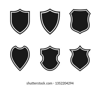 Shields graphic icons set. Blank heraldic shields signs isolated on white background. Web protection symbols. Vector illustration