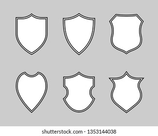 Shields graphic icons set. Blank heraldic shields signs isolated on gray background. Web protection symbols. Vector illustration