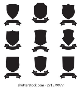 Shields and stylish ribbon set isolated on white background. Different black shield shapes collection.  Heraldic royal design. Vector illustration.