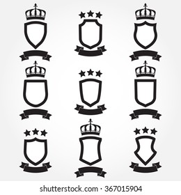 Shields and stylish ribbon set isolated on white background. Collection of different black shield shapes with ribbon, crown and stars. Heraldic royal design. Vector illustration.