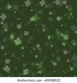 Shine Shamrocks on black background Seamless. Vector