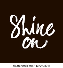 Shine. White word on black background. Inspirational design for print on tee, card, banner, poster, hoody. ink hand lettering. Modern brush calligraphy. Vector illustration