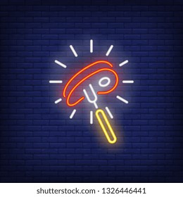 Shining beef steak on fork neon sign. Meat cooking, dinner and restaurant concept design. Night bright neon sign, colorful billboard, light banner. Vector illustration in neon style.