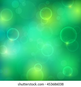 Shining green background with light effects. Magic defocused glitter sparkles. Blurred soft backdrop. Vector illustration. EPS10