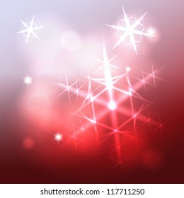 Shining snowflake christmas star over blurry wine colorful background