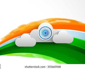 Shiny Ashoka Wheel on clouds and tricolour waves decorated background for Happy Indian Republic Day celebration.