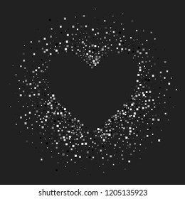 A shiny background of small squares to form a heart on a black background. Luxurious pattern with silver dust effect.