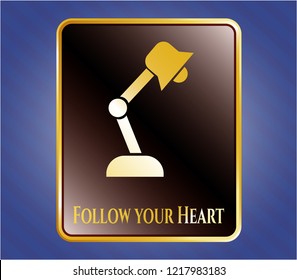  Shiny badge with desk lamp icon and Follow your Heart text inside