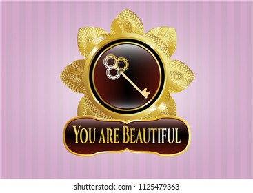   Shiny badge with key icon and You are Beautiful text inside