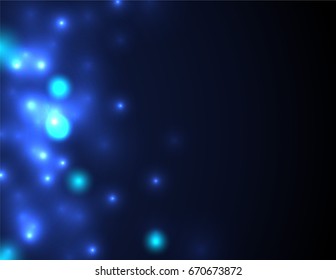 Shiny blue glowing lights and sparkles on black background. Creative design templates