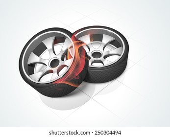 Shiny car wheels with fire flames on floor background. 