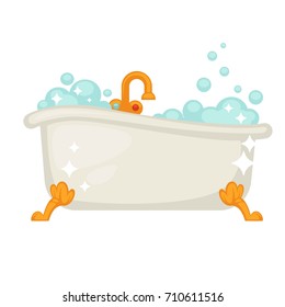Shiny ceramic bath on golden legs full of bubbles