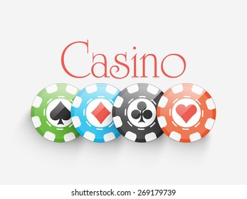 Shiny colorful Casino chips on grey background.