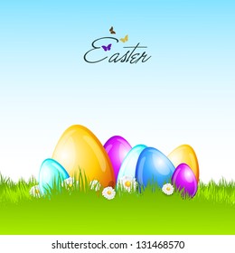 Shiny colorful Easter eggs on nature background.