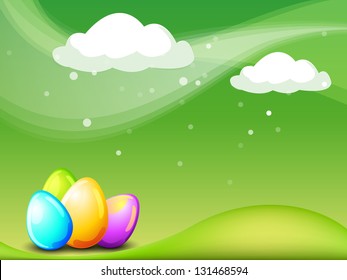 Shiny colorful Easter eggs on nature background.