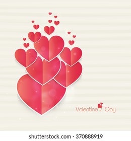 Shiny elegant paper hearts on abstract background for Happy Valentine's Day celebration.