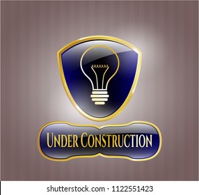  Shiny emblem with idea icon and Under Construction text inside