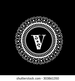 Shiny English Alphabet V in beautiful floral frame for stylish monogram design on black background. 