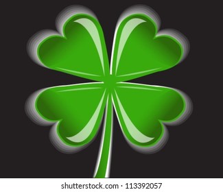 shiny four-leaf clover on a black background