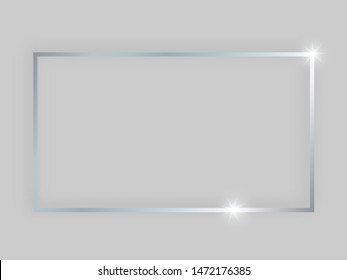 Shiny frame with glowing effects. Silver rectangular frame with shadow on grey background. Vector illustration