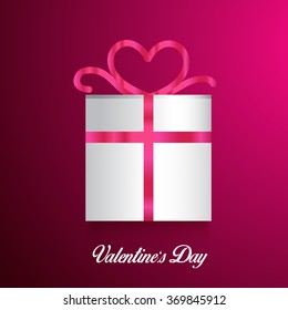 A shiny gift box on pink background for happy valentine's day.