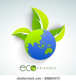 Shiny globe with fresh green leaves for Eco Friendly concept.