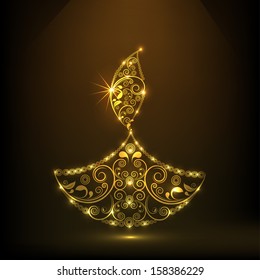 Shiny golden floral decorated oil lit lamp on brown background for Indian festival of lights, Shubh Deepawali (Happy Deepawali). 