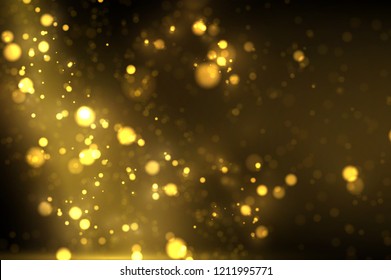 Shiny golden particles on dark. Glowing yellow bokeh abstract luxury background