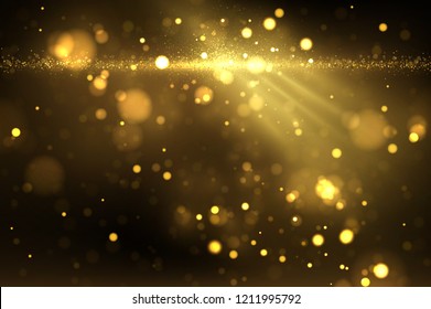 Shiny golden particles on dark. Glowing yellow bokeh abstract luxury background