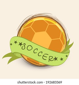 Shiny golden soccer ball with green ribbon and stylish text soccer on abstract background, can be use in flyer, poster and banner design.