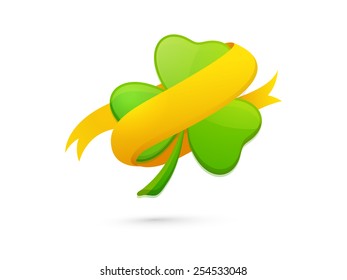 Shiny green shamrock leaf with golden ribbon on white background for Happy St. Patrick's Day celebrations.