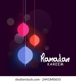 Shiny hanging paper lanterns, concept for Islamic holy month of prayers Ramadan Kareem celebrations.