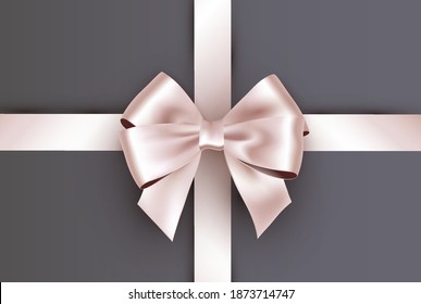 Shiny ivory white satin ribbon on gray background.