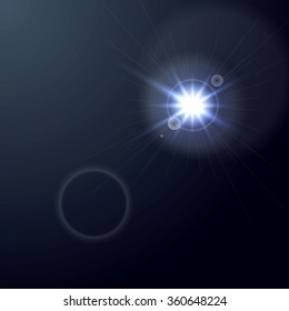 Shiny light lens flare on dark blue background. Vector glow star graphic design