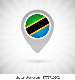 Shiny map pin with flag of Tanzania country. Abstract map marker with flag over classic background