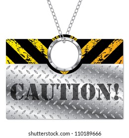 Shiny metallic caution sign hanging on chains