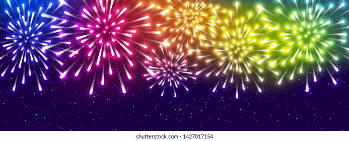 Shiny rainbow fireworks on starry sky background - horizontal panoramic banner for Your holiday design