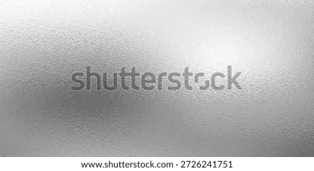 Shiny silver foil metallic texture - glossy gray steel gleaming surface, frosted glass effect with blur glare reflection, bright polished metal material. Brushed aluminum or chrome glistening bg.