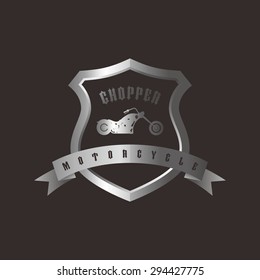 shiny silver shield chopper motorcycle