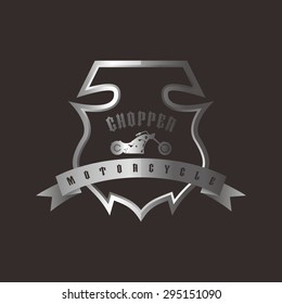 shiny silver shield chopper motorcycle