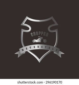 shiny silver shield chopper motorcycle