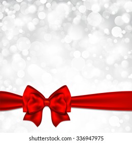 Shiny silver starry christmas background with red bow.