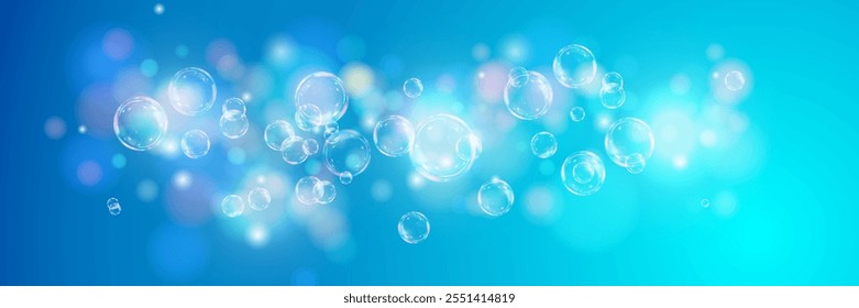 Shiny soap bubbles floating in the air.Abstract soap bubble on a blue background with bokeh effect.