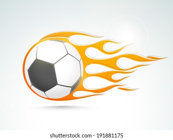 Shiny soccer ball in flame on blue background. 