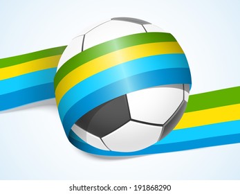 Shiny soccer ball wrapped in colourful stripes on blue background. 