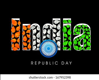 Shiny stylish text India in national tricolours with ashoka wheel on black background. 
