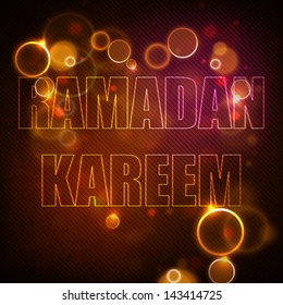 Shiny text Ramadan Kareem on abstract background.