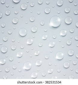 shiny water drops on a light background