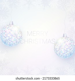 Shiny Winter Banner Design. Two Balls Made from Iridescent Foil Particles. Text Merry Christmas. Snowflake Frame. Vector Illustration.